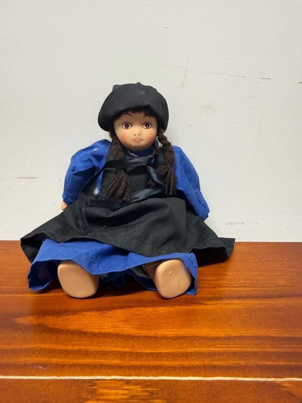 Vintage Porcelain Amish Girl Doll with Blue Dress and Black Apron